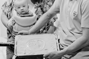 New born baby and the hand and foot cast into glass
