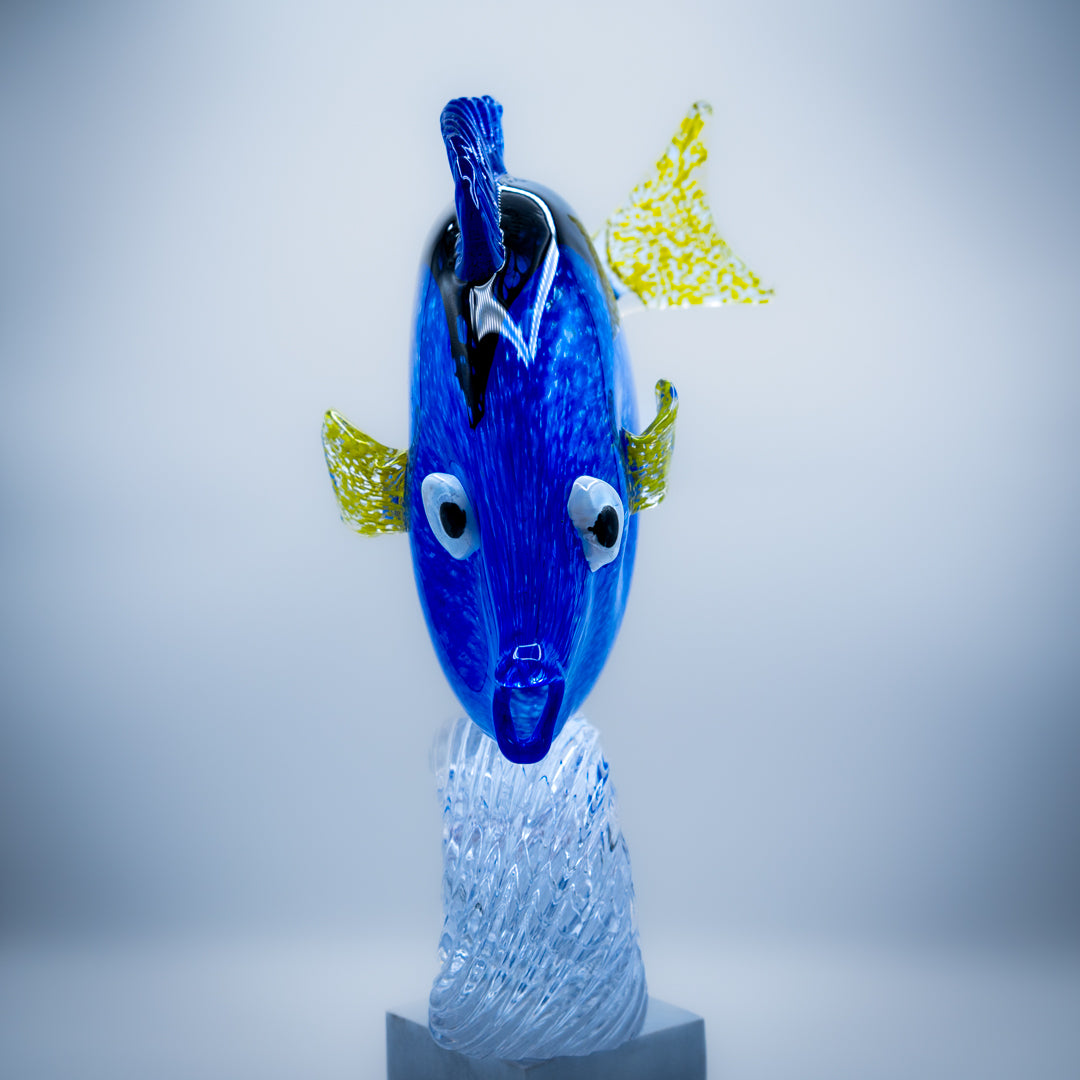 Regal Blue Tang Fish riding a wave