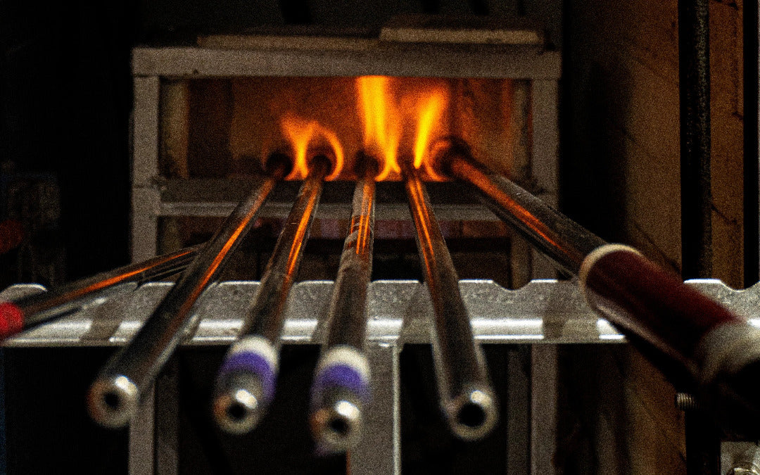 Blowing pipes in the fire